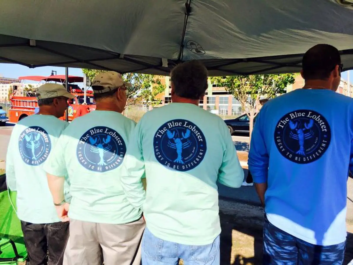 Men with The Blue Lobster shirts on