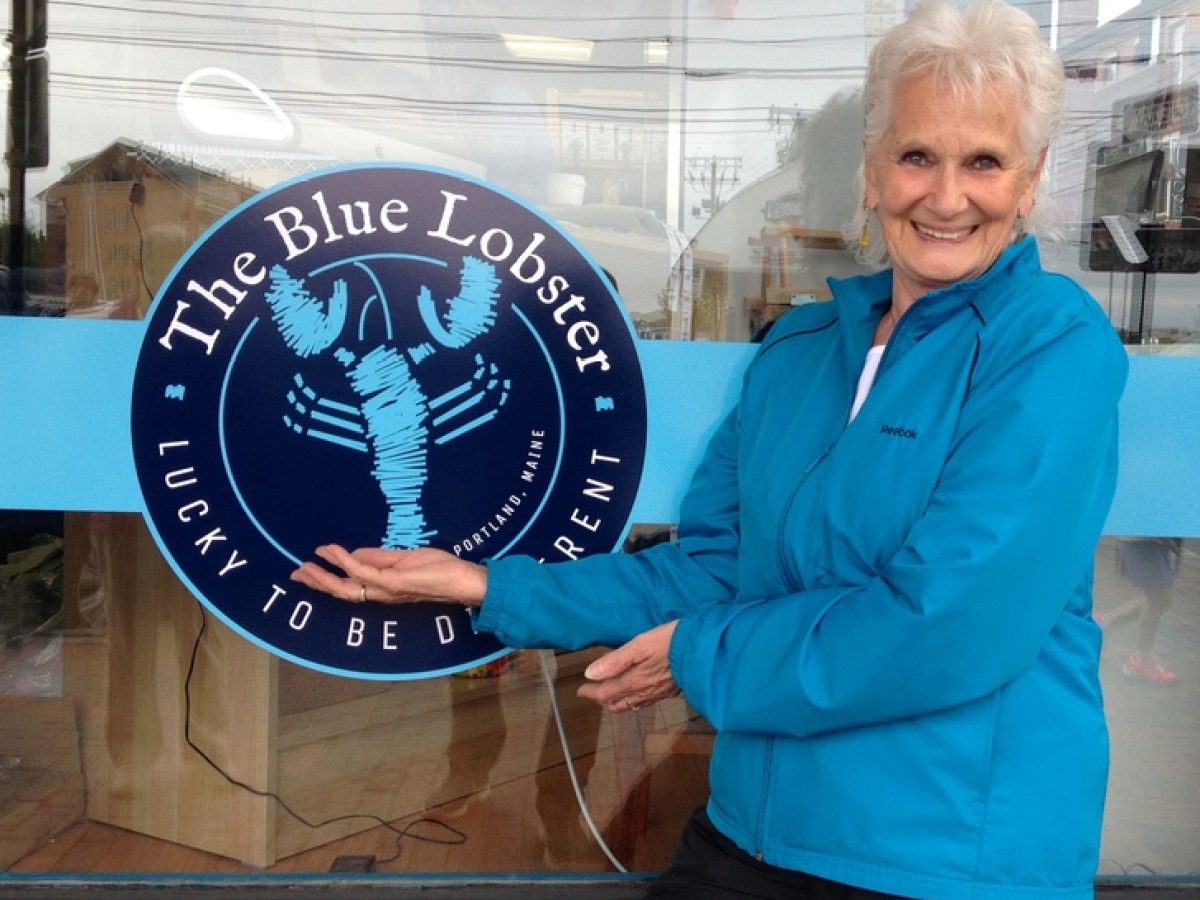 The Blue Lobster sign with lady